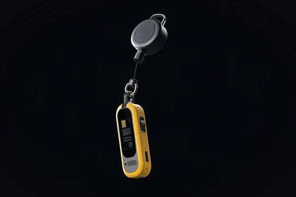 A thin card computer in a badge holder on a retractable reel, seen almost edge-on